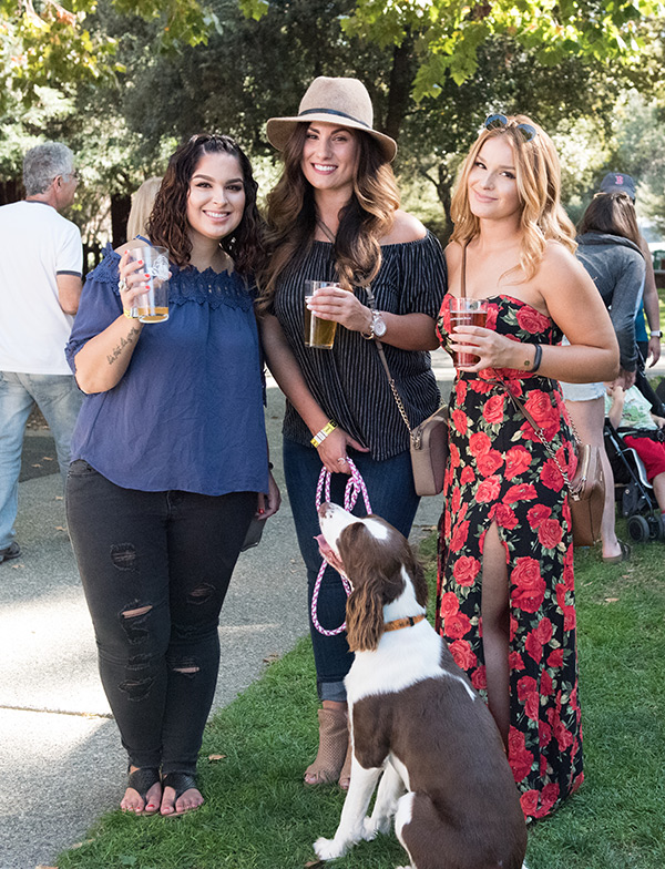 women and dog at festival