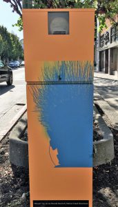 utility box painted with hair sillouette